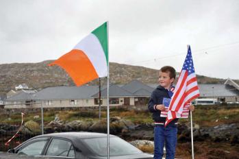 Michael Ó Cathasaigh, age 5, of Dubhithir, Carna, County Galway awaits the arrival of Mayor Walsh in Carna on Tuesday, Sept. 23.